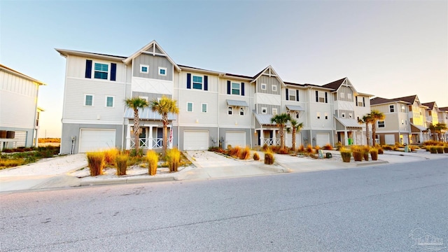 townhome / multi-family property featuring a garage