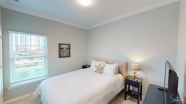 bedroom with carpet and crown molding