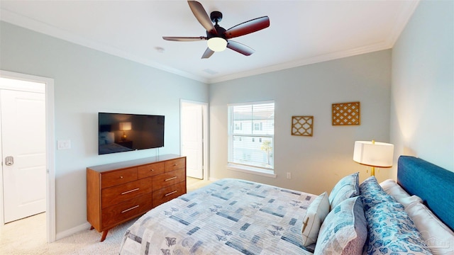 bedroom with ornamental molding, ceiling fan, and light colored carpet