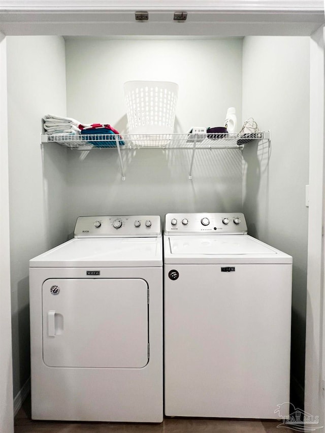 washroom featuring washer and clothes dryer