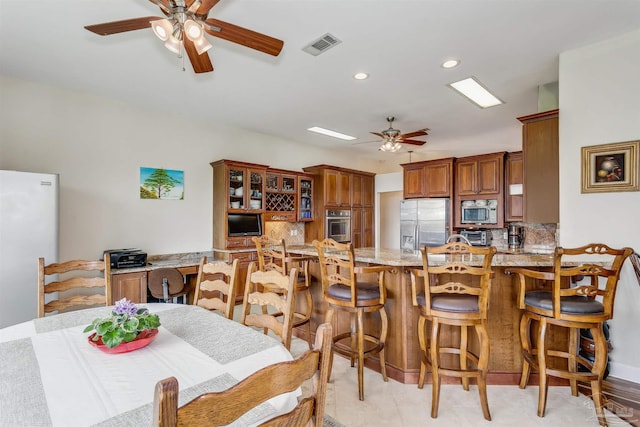 dining area featuring ceiling fan