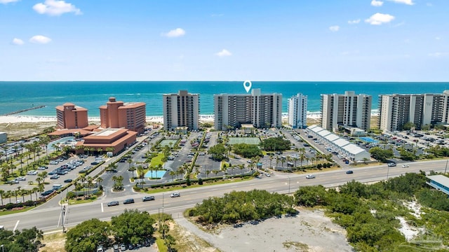 birds eye view of property with a water view and a view of the beach