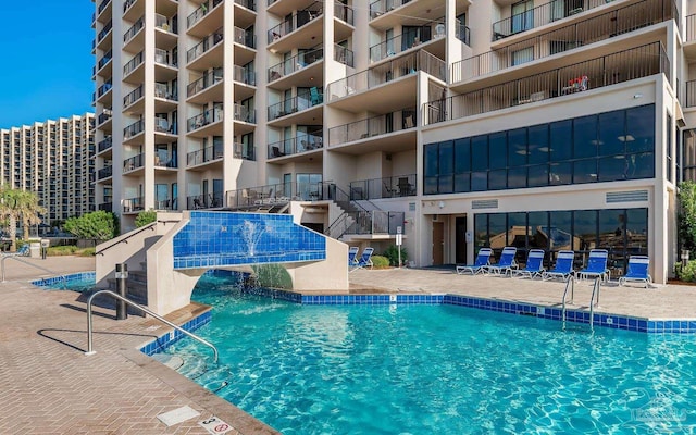 community pool featuring a patio
