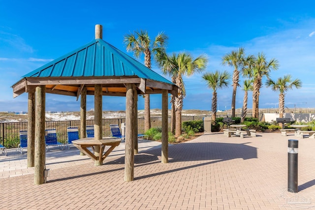 view of patio with a gazebo and fence