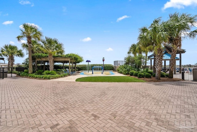 surrounding community featuring a gazebo and fence