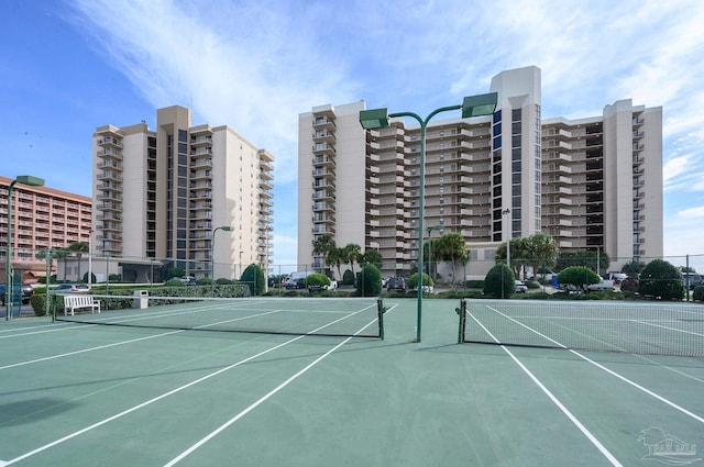 view of tennis court with fence