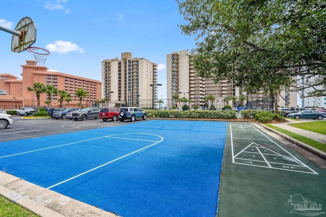 view of sport court with community basketball court and fence