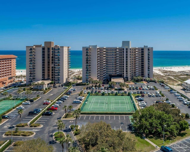 aerial view featuring a water view and a beach view