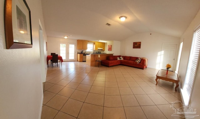 tiled living room with vaulted ceiling