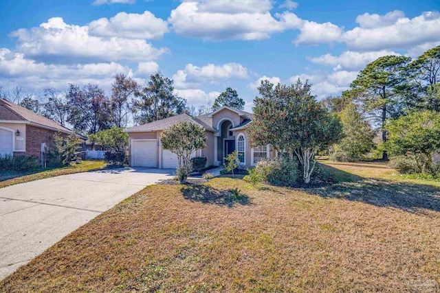 single story home with a garage and a front yard