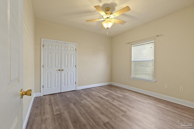 unfurnished room featuring ceiling fan and light hardwood / wood-style flooring