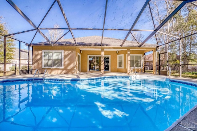 view of pool with a lanai