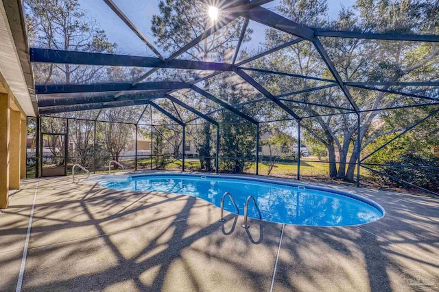 view of pool featuring a lanai and a patio