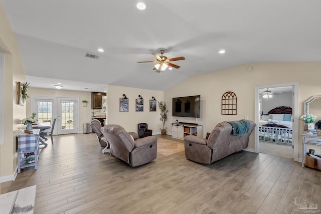 living area featuring visible vents, recessed lighting, light wood-style floors, ceiling fan, and vaulted ceiling