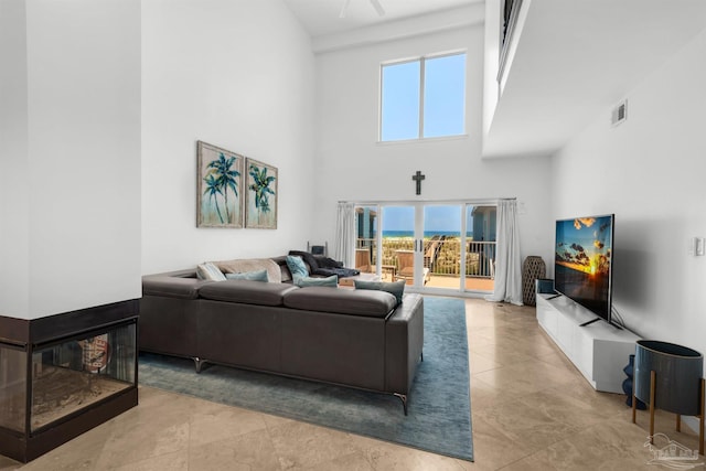 1299 Ft Pickens Rd Unit 6, Pensacola Beach, FL 32561 - living area with visible vents and a towering ceiling