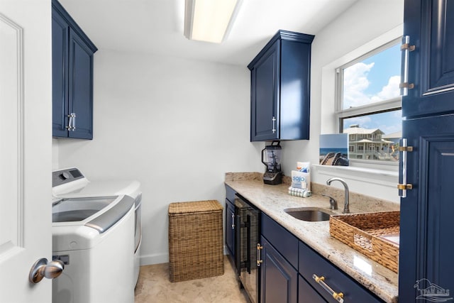 1299 Ft Pickens Rd Unit 6, Pensacola Beach, FL 32561 - laundry room with wet bar, cabinet space, a sink, wine cooler, and washing machine and dryer