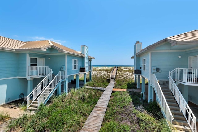 1299 Ft Pickens Rd Unit 6, Pensacola Beach, FL 32561 - view of yard featuring a porch and stairway