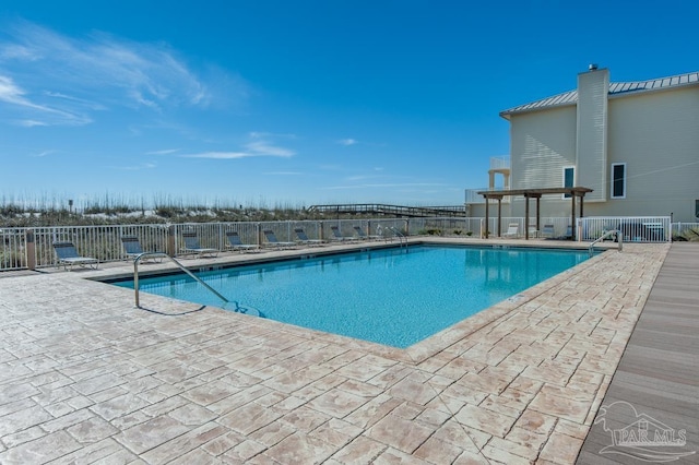 1299 Ft Pickens Rd Unit 6, Pensacola Beach, FL 32561 - community pool featuring a patio and fence