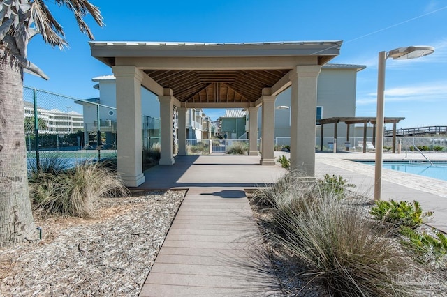 1299 Ft Pickens Rd Unit 6, Pensacola Beach, FL 32561 - view of home's community with a gazebo, a swimming pool, a pergola, and fence