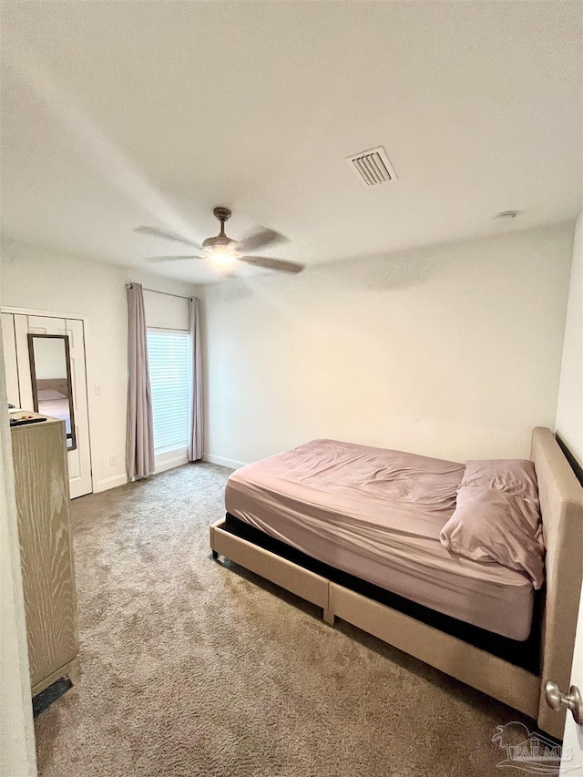 1315 W Scott St, Pensacola, FL 32501 - bedroom with baseboards, visible vents, ceiling fan, and carpet