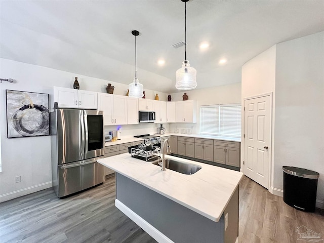 1315 W Scott St, Pensacola, FL 32501 - kitchen with a sink, smart refrigerator, wood finished floors, and baseboards