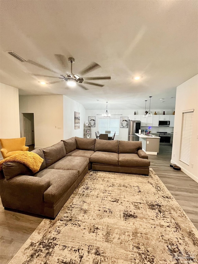 1315 W Scott St, Pensacola, FL 32501 - living area featuring baseboards, visible vents, wood finished floors, and a ceiling fan