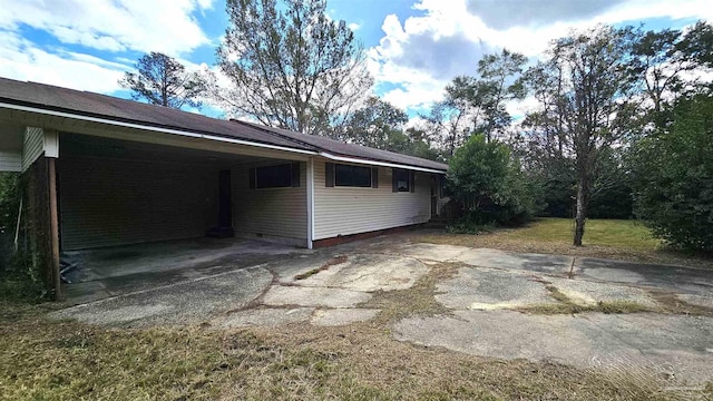 view of home's exterior with a carport