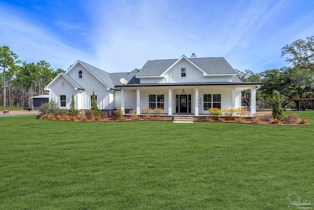 modern inspired farmhouse with covered porch and a front lawn