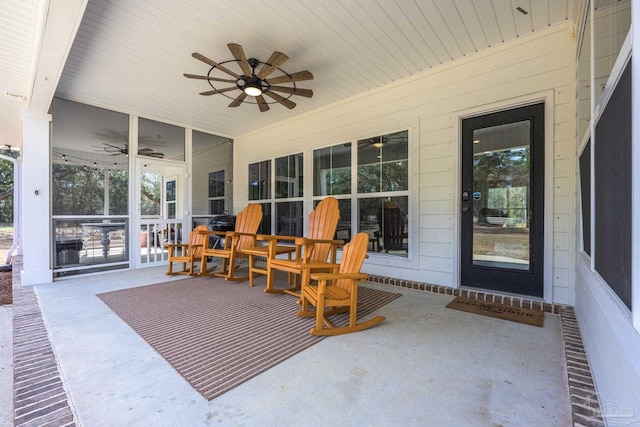 view of patio with ceiling fan and wood ceiling