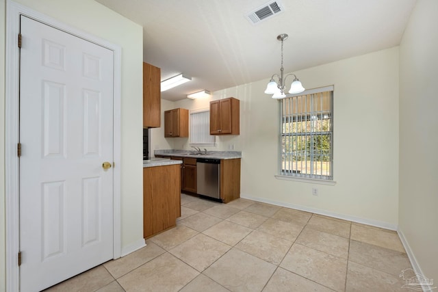 kitchen featuring stainless steel dishwasher, sink, an inviting chandelier, hanging light fixtures, and light tile patterned flooring