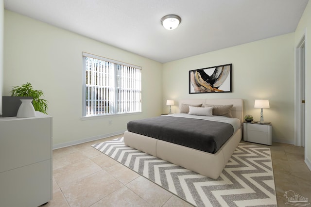 bedroom featuring light tile patterned floors