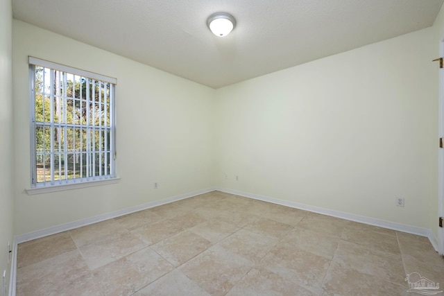 empty room featuring a textured ceiling