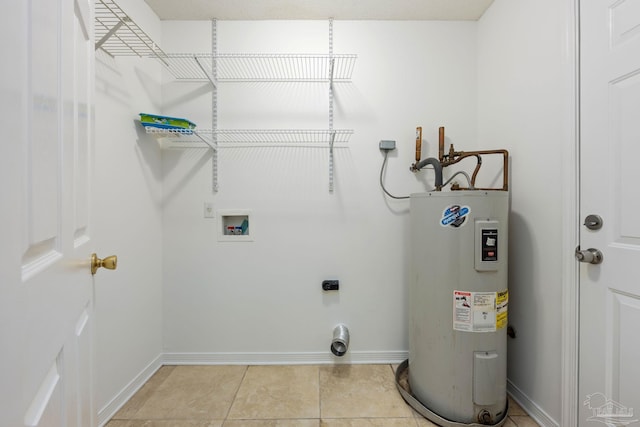 laundry area with electric dryer hookup, light tile patterned floors, hookup for a washing machine, and water heater