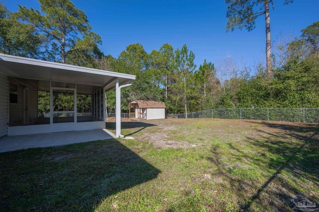 view of yard with a storage unit and a sunroom