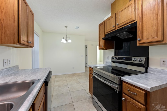 kitchen with pendant lighting, an inviting chandelier, sink, light tile patterned floors, and appliances with stainless steel finishes