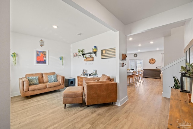 living room with light hardwood / wood-style floors