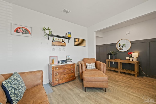 sitting room featuring light hardwood / wood-style flooring