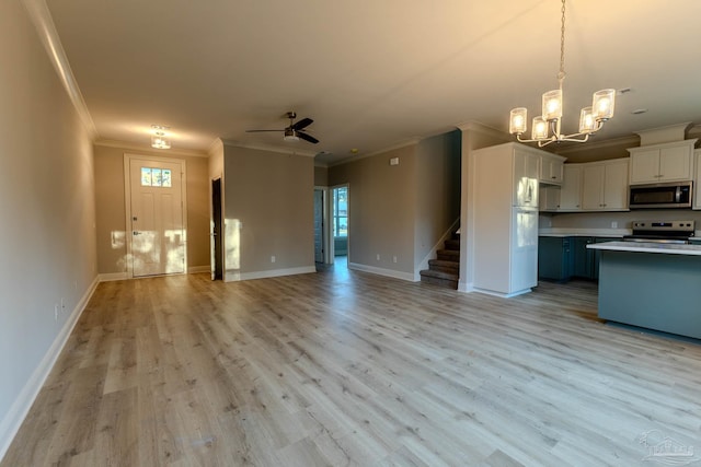 kitchen featuring light hardwood / wood-style floors, stainless steel appliances, and crown molding