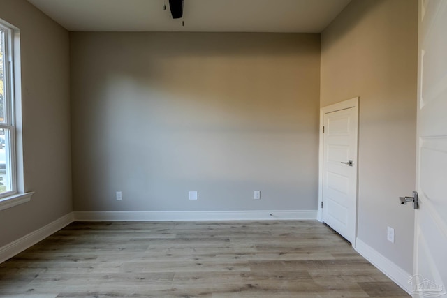 unfurnished room with light hardwood / wood-style floors and a healthy amount of sunlight