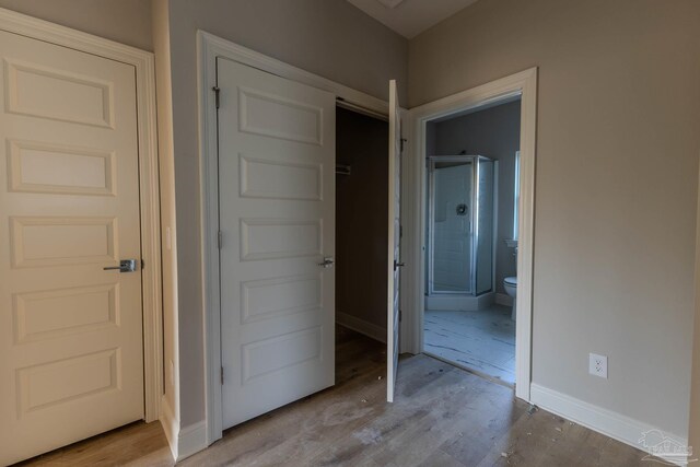 hallway featuring light hardwood / wood-style flooring