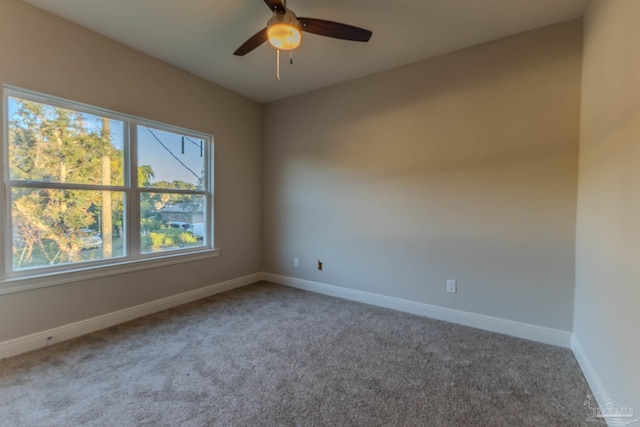 unfurnished room featuring carpet and ceiling fan