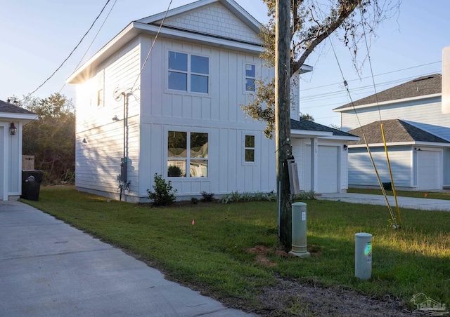 view of side of home with a lawn