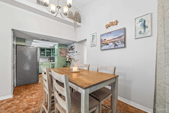 dining space with a chandelier