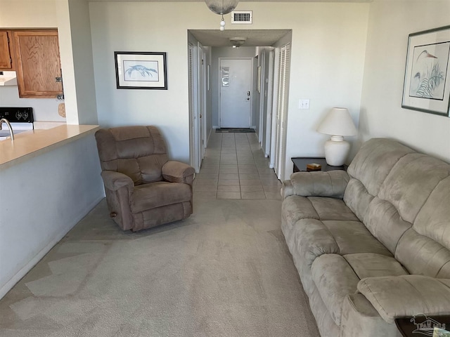 living room featuring light carpet