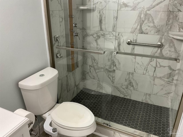 bathroom with toilet and walk in shower