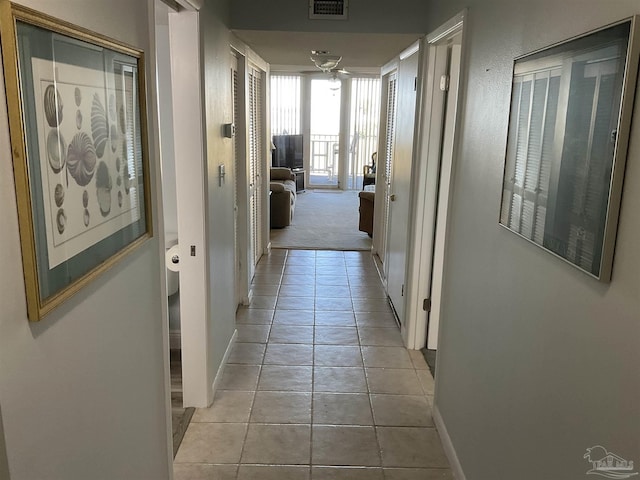 corridor with light colored carpet