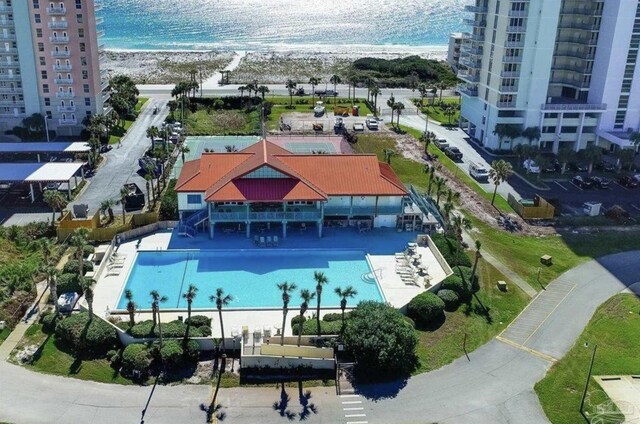 bird's eye view with a water view and a view of the beach