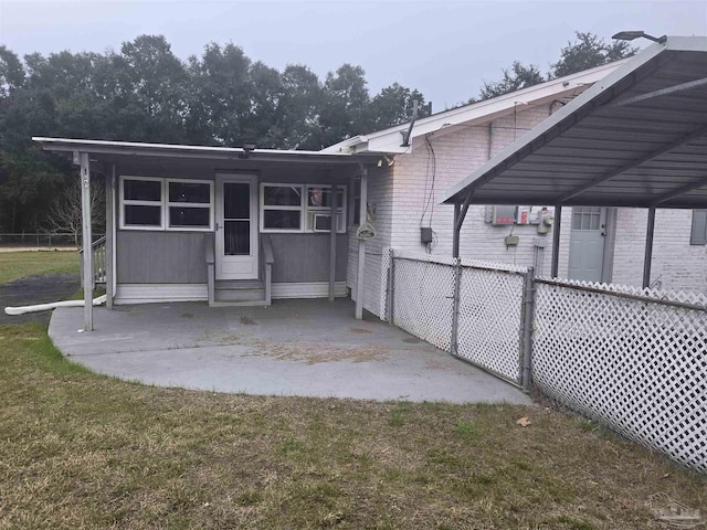 rear view of house featuring a carport