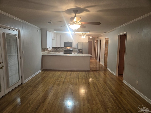 kitchen featuring white cabinets, crown molding, dark hardwood / wood-style floors, kitchen peninsula, and stainless steel appliances