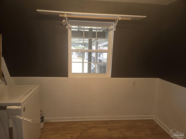 laundry area featuring dark hardwood / wood-style flooring and washing machine and dryer